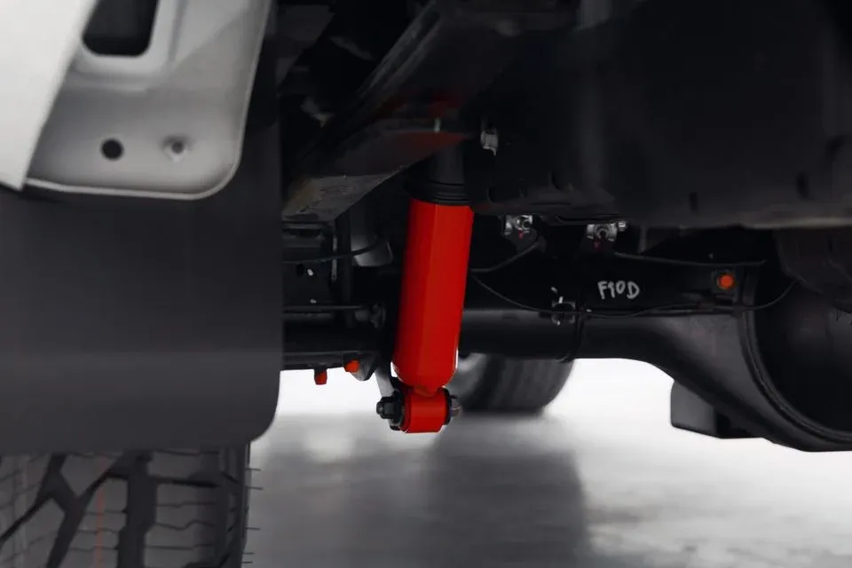 Triton Raider Premcar red damper detail underneath the vehicle