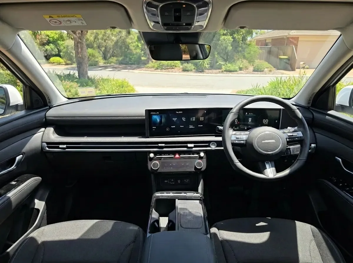 Hyundai Tucson Hybrid 2WD interior showing touchscreen, dashboard and front seats